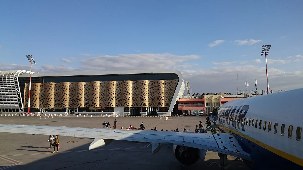 Airside view of Marrakech Menara Airport terminal with aircraft