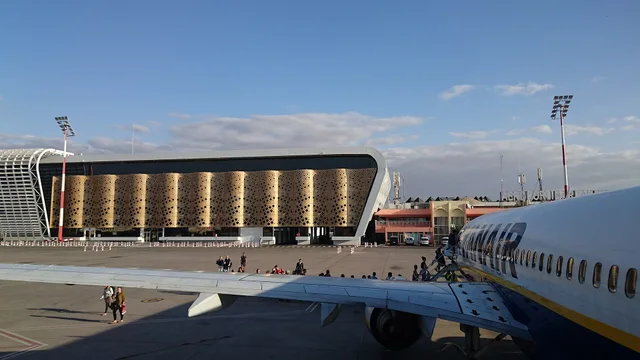Airside view of Marrakech Menara Airport terminal with aircraft